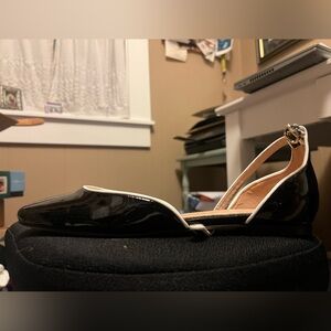 Women’s brand new black Mary Jane’s with white detail.